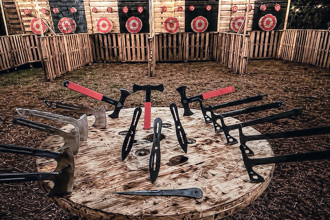Axes in the foreground of The Forest Villas shared axe range, with target lanes beyond